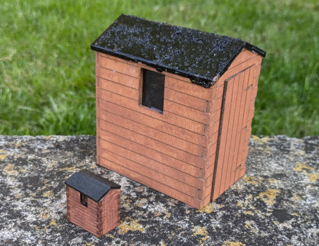 Laser cut sheds for a model railway, one in G-Scale, one in OO, both created using software code