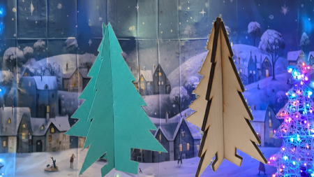 3D Christmas Trees. One cut out of green card, the other laser cut from wood. Designed in FreeCAD.